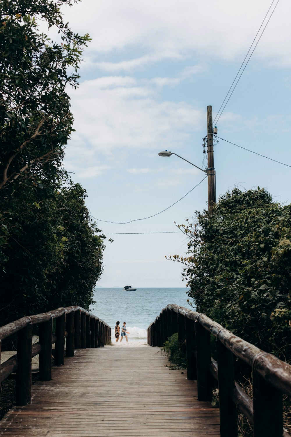 a wooden walkway leading to the beach