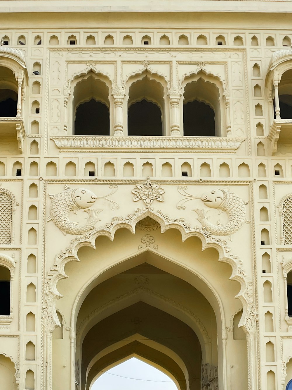 a large white building with a clock on it's side