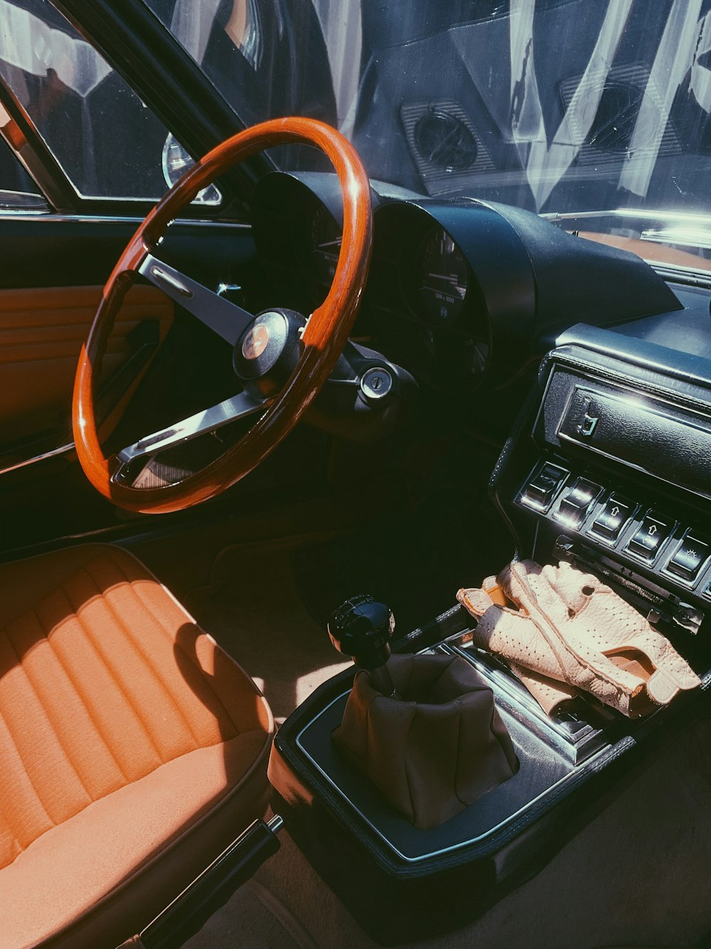 the interior of a car with a steering wheel and dashboard