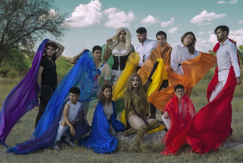 a group of people posing for a picture in a field