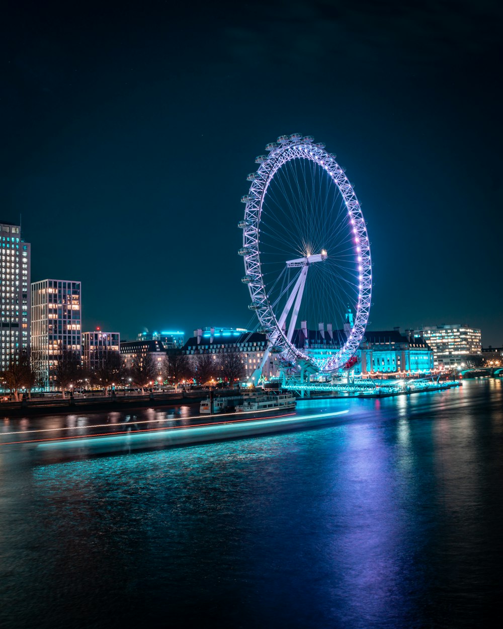 a large ferris wheel in the middle of a body of water