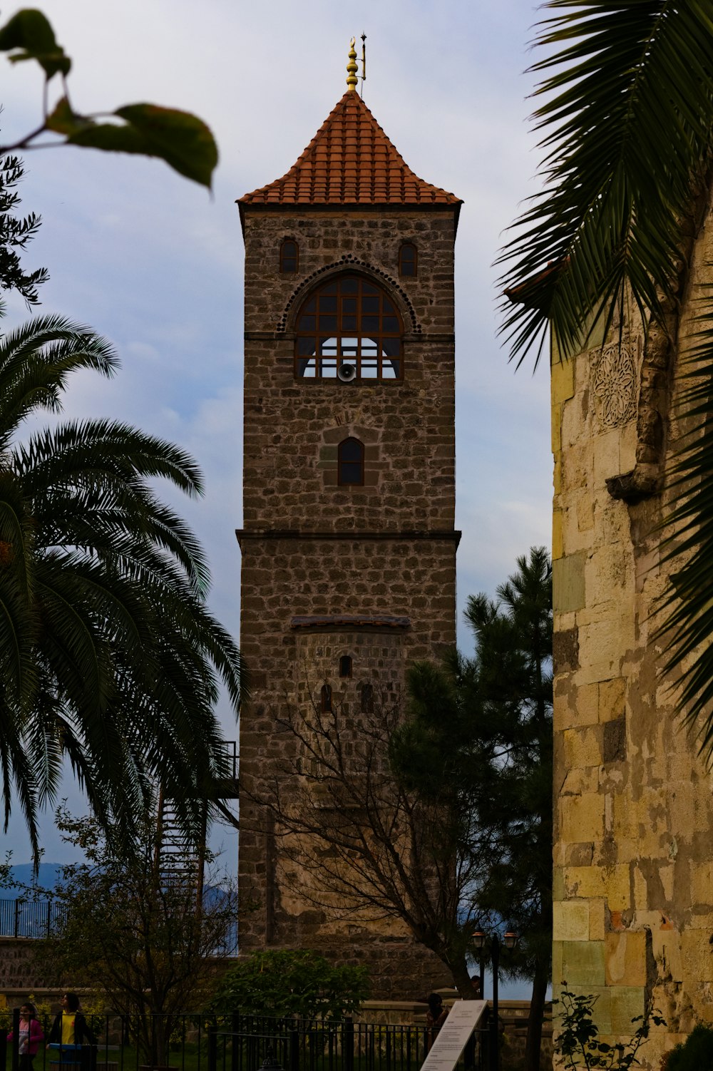 a tall tower with a clock on the top of it