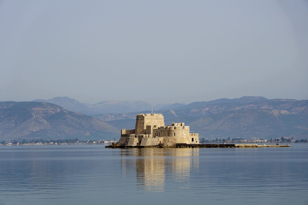 a castle sitting in the middle of a lake