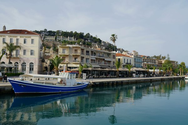A blue and white boat is docked in the water — Nafplio, Greece