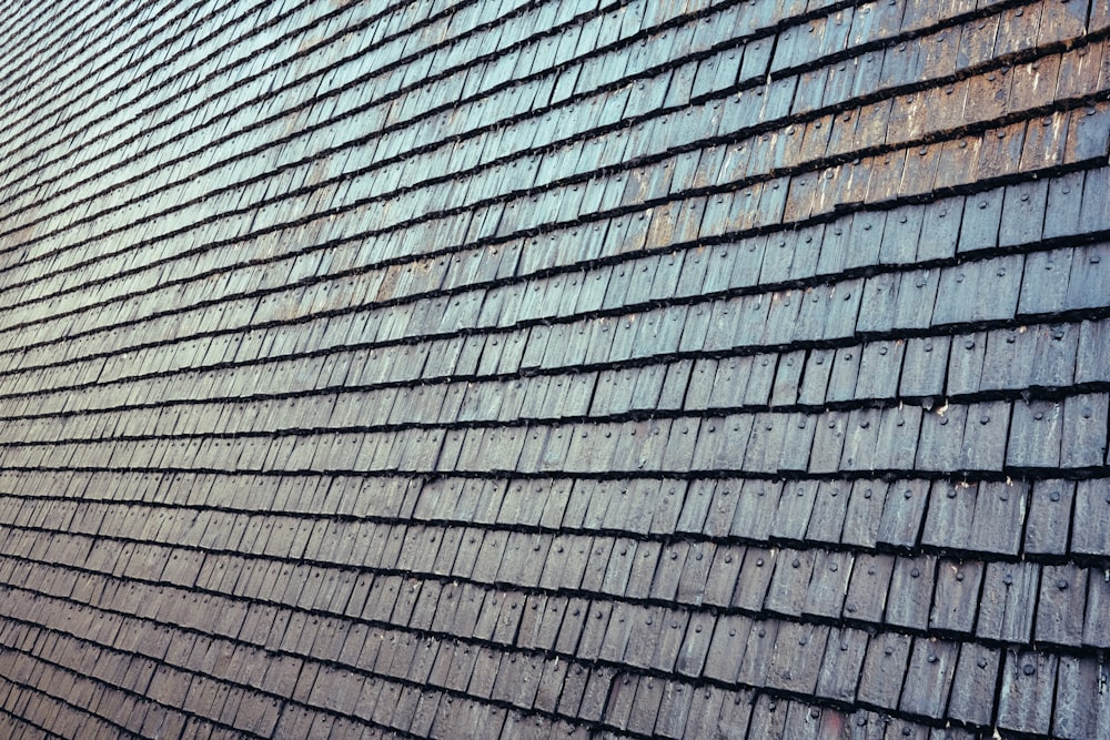 a close up of a building with a clock on the side of it