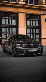 A clean, modern PCO licensed car waiting outside a city building.
