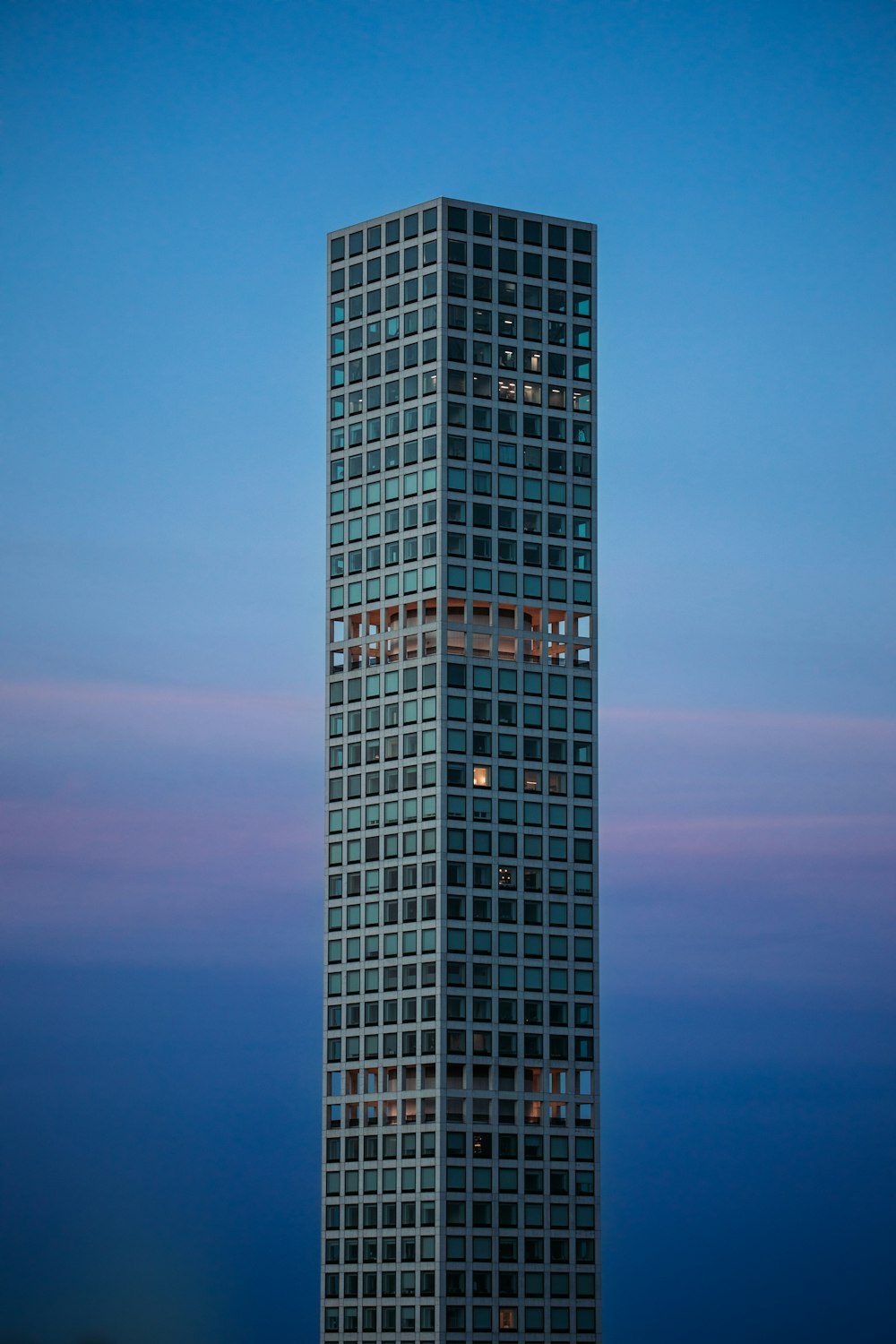 a very tall building with a sky background