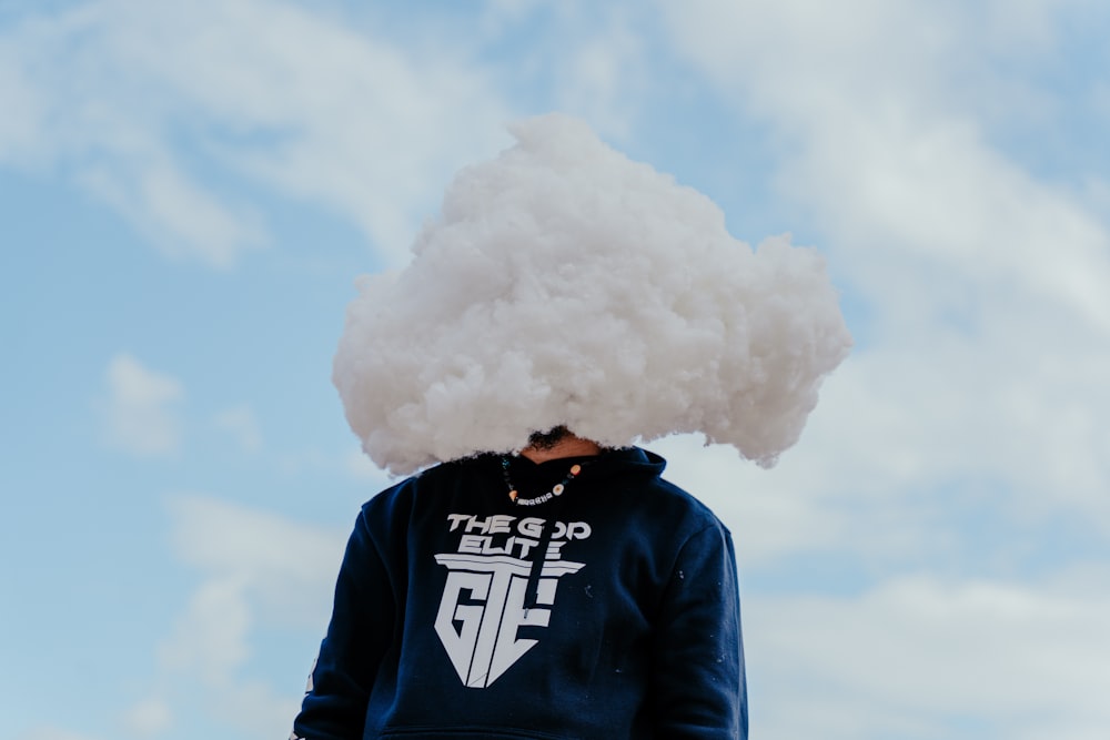 a person with a cloud on their head