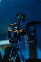 a video camera sitting on top of a tripod