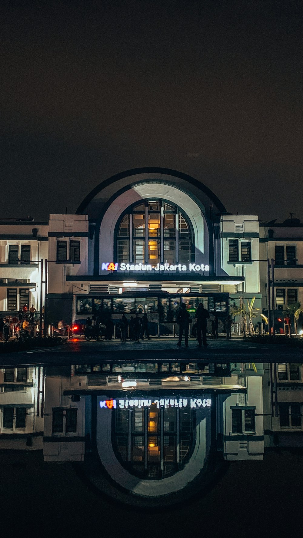 a building with a reflection in the water