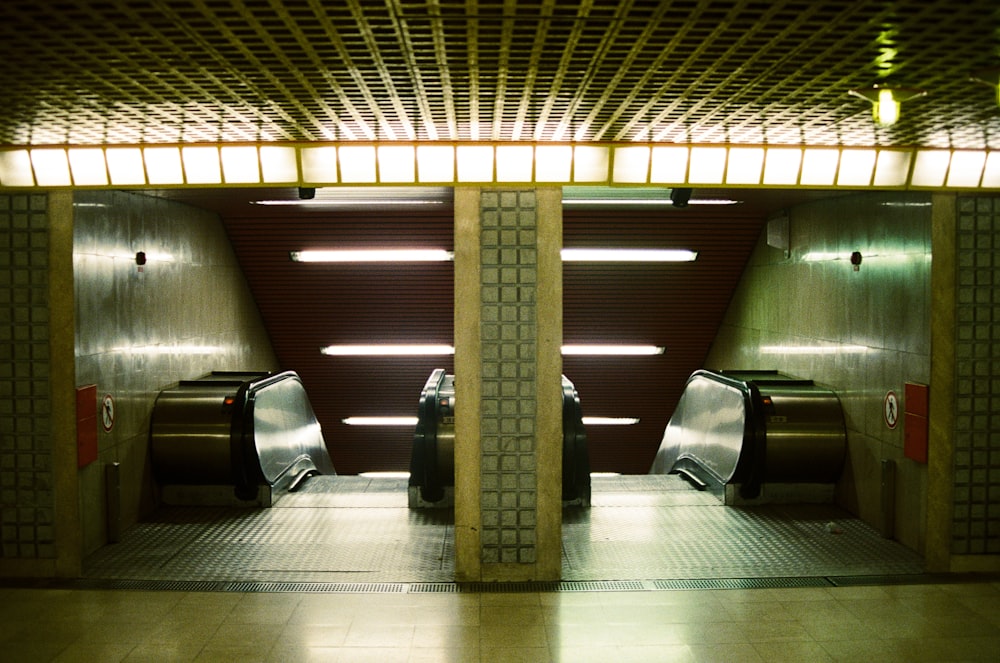 a subway station with a row of urinals