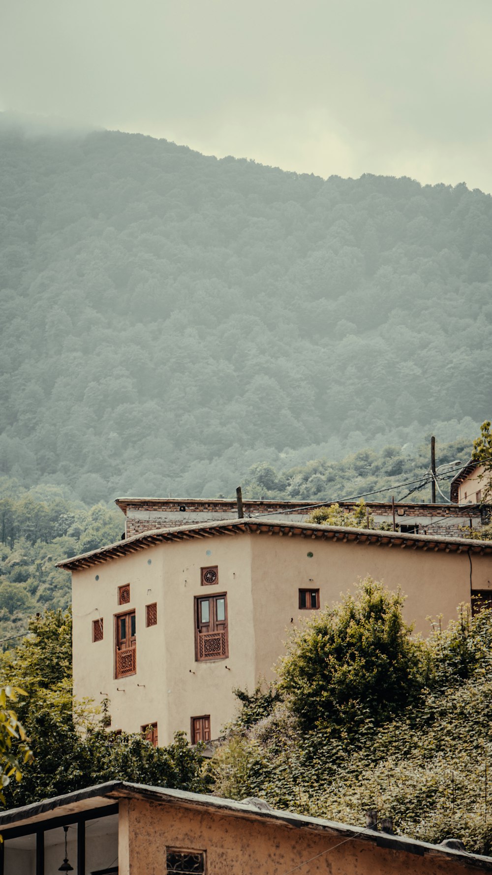 a building with a mountain in the background