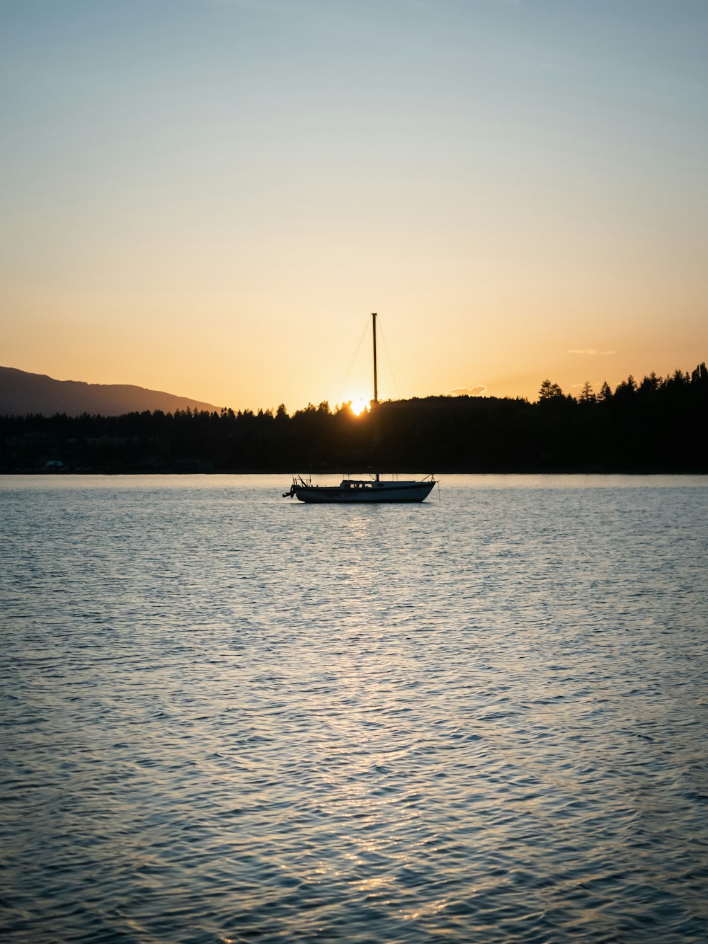 a boat floating on top of a large body of water