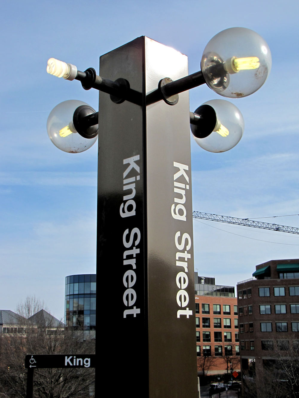 a street light with street lights on top of it