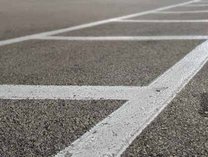 a parking lot with white lines painted on it