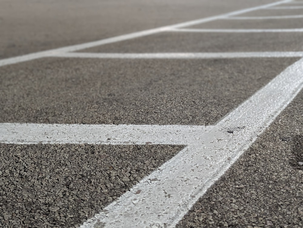 a parking lot with white lines painted on it