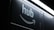 A dark image featuring the word 'hub' and an Amazon smile logo beneath a bright, white fluorescent light strip.