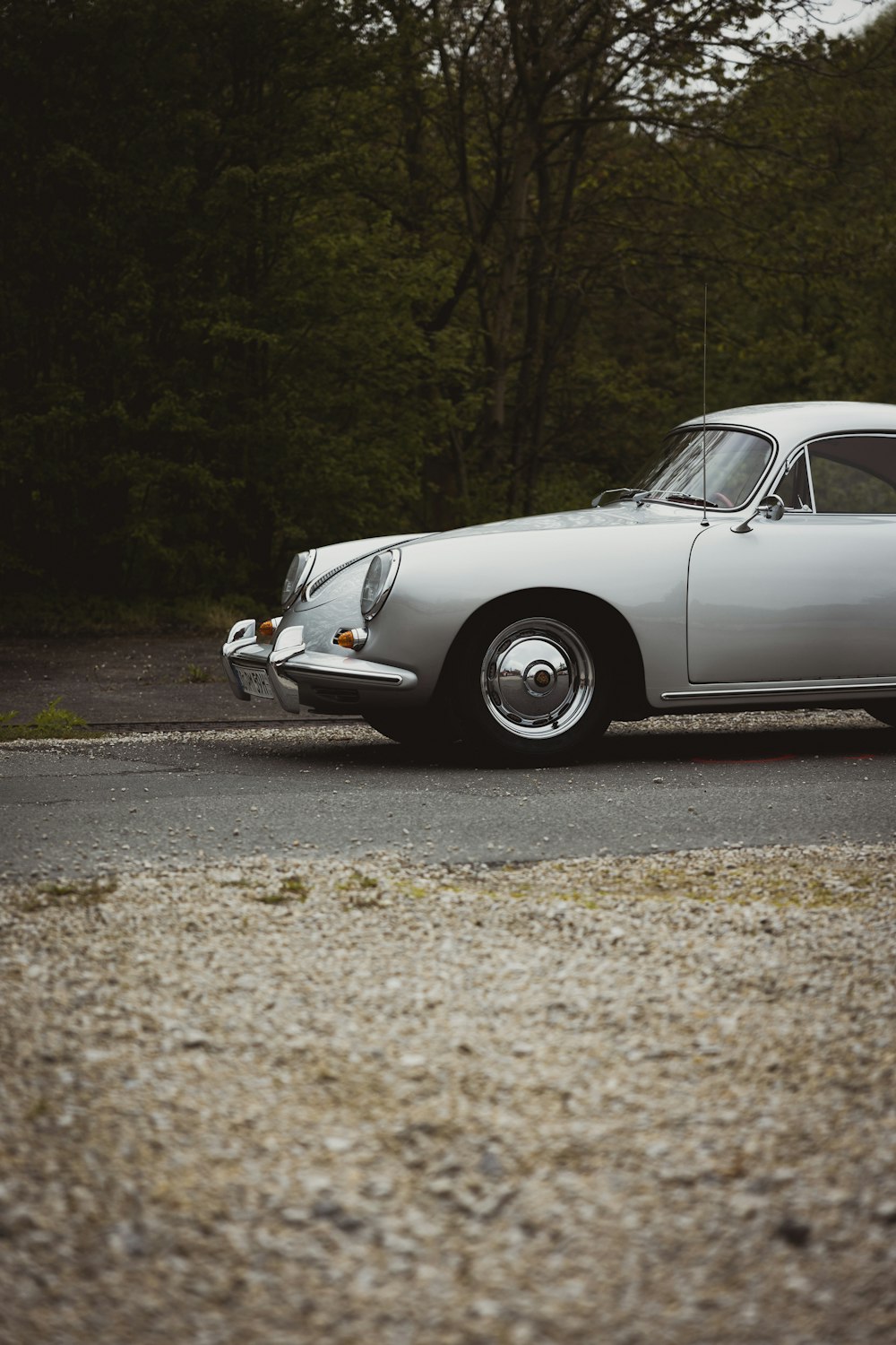 a silver car parked on the side of the road