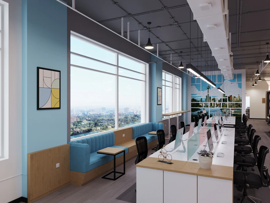 A sleek modern office space with blue and cyan tech-themed lighting, showcasing a team collaborating around futuristic digital screens.