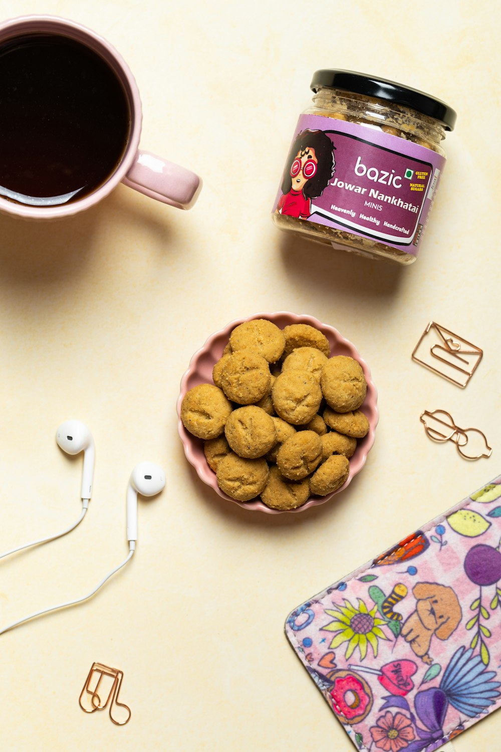 a cup of coffee and some cookies on a table