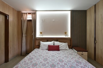 A beautifully designed bedroom with a comfortable bed and warm tones.