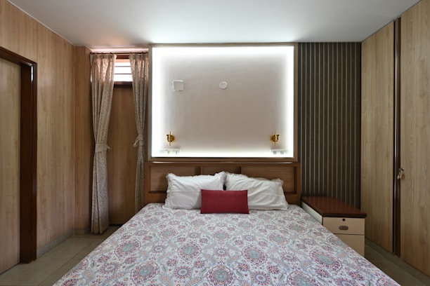 Cozy and inviting guest room with warm lighting and comfortable bedding.