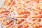 A stack of adorable stickers features a whimsical illustration of a fluffy white dog wrapped in a flaky croissant with strawberries and small star decorations. The artwork combines bright, warm colors and playful elements, creating a cozy and charming aesthetic.