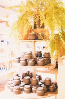 Elegant black and rose gold spice jars arranged on a sleek marble countertop.