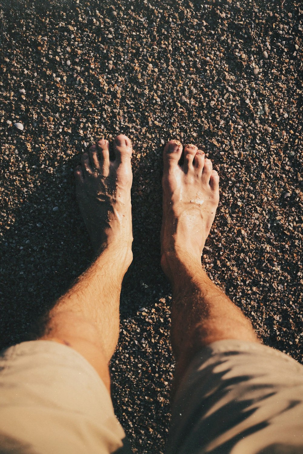 a man standing on top of a sandy beach