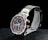 A sleek wristwatch with a stainless steel band featuring gold accents. The watch face combines dark and light elements in a sophisticated design, showcasing several subdials with gold hands and markers. The brand name is visible on the face, adding to its luxurious appeal.