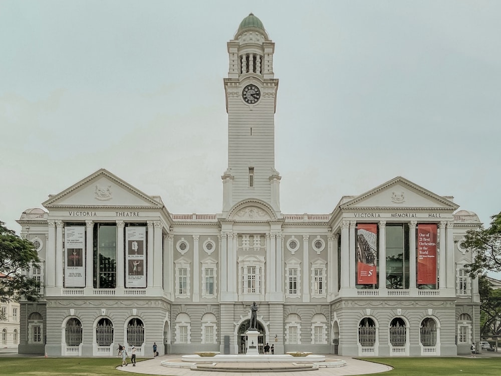 a large white building with a clock tower