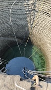 A clean water well surrounded by happy community members.