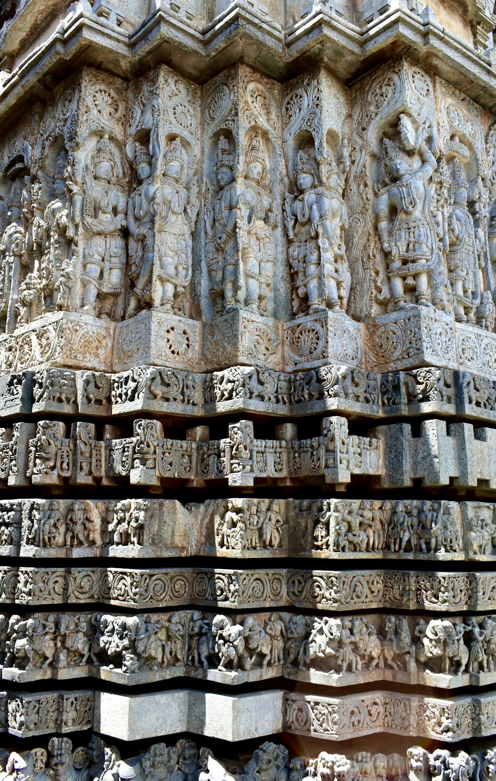 a close up of a wall with carvings on it