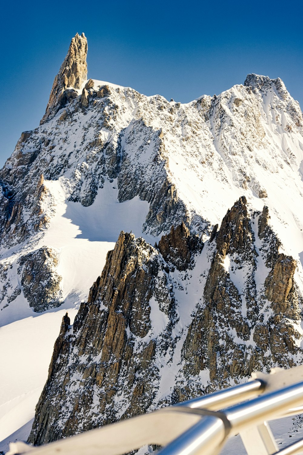 a view of a snowy mountain from a plane