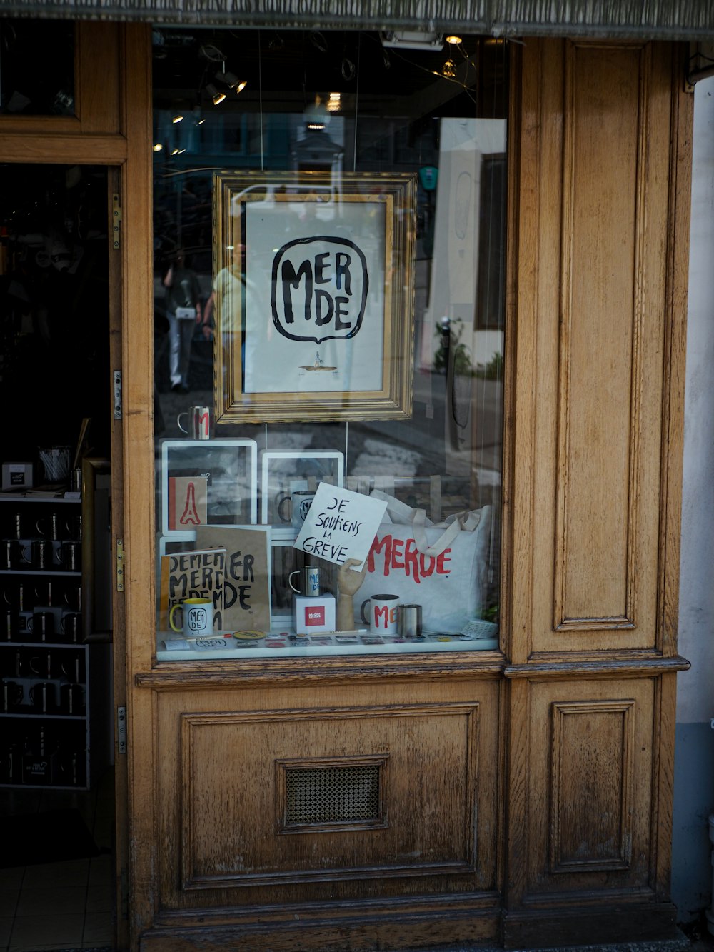 a store front with a sign in the window