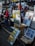 A young artist proudly displaying their colorful painting at a local art fair.