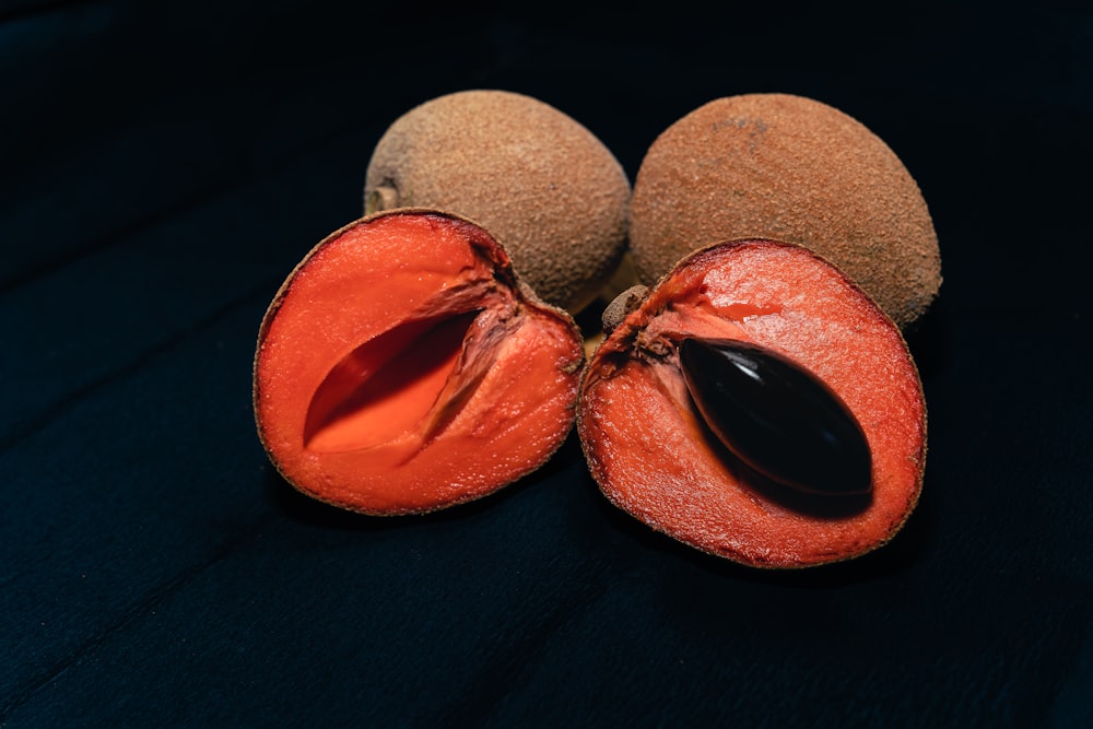 a couple of pieces of fruit sitting on top of a table