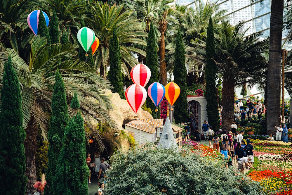 a bunch of hot air balloons floating in the air