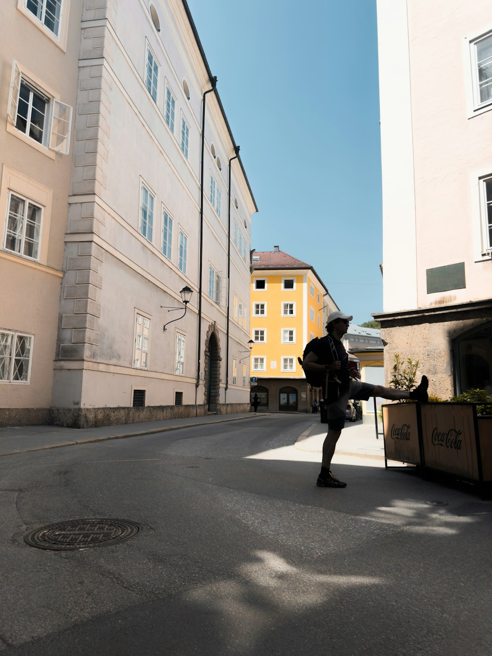 a person with a backpack walking down a street