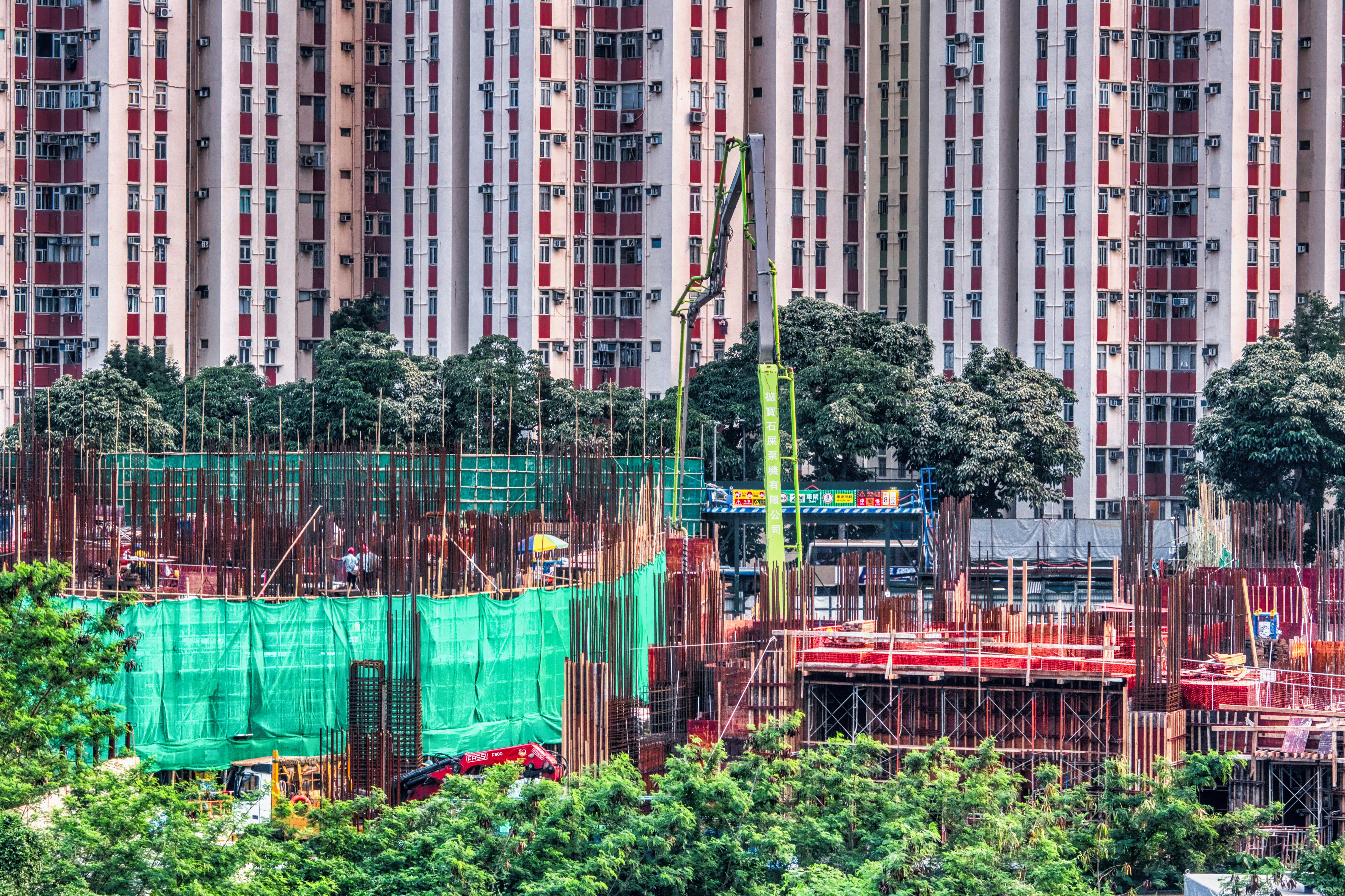 Construction site in urban area with tall buildings