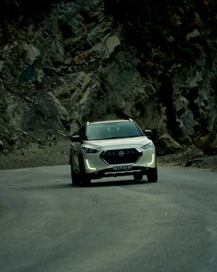 A family-friendly SUV driving through a scenic landscape.