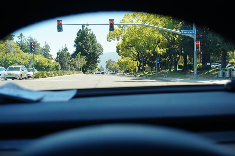a view of a street from inside a car