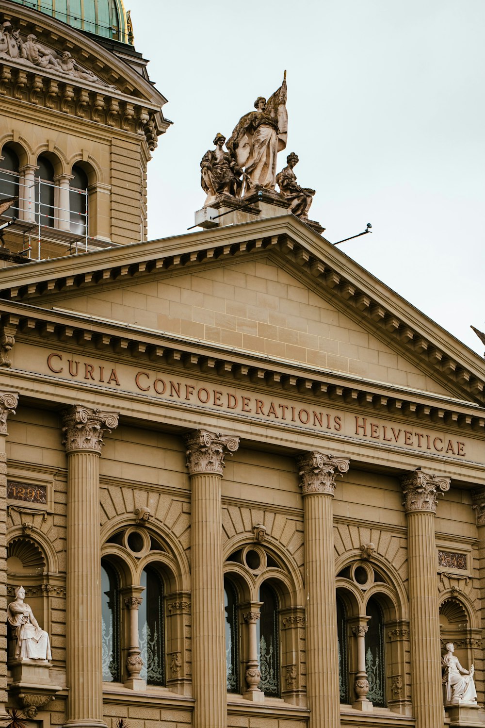 a large building with statues on top of it