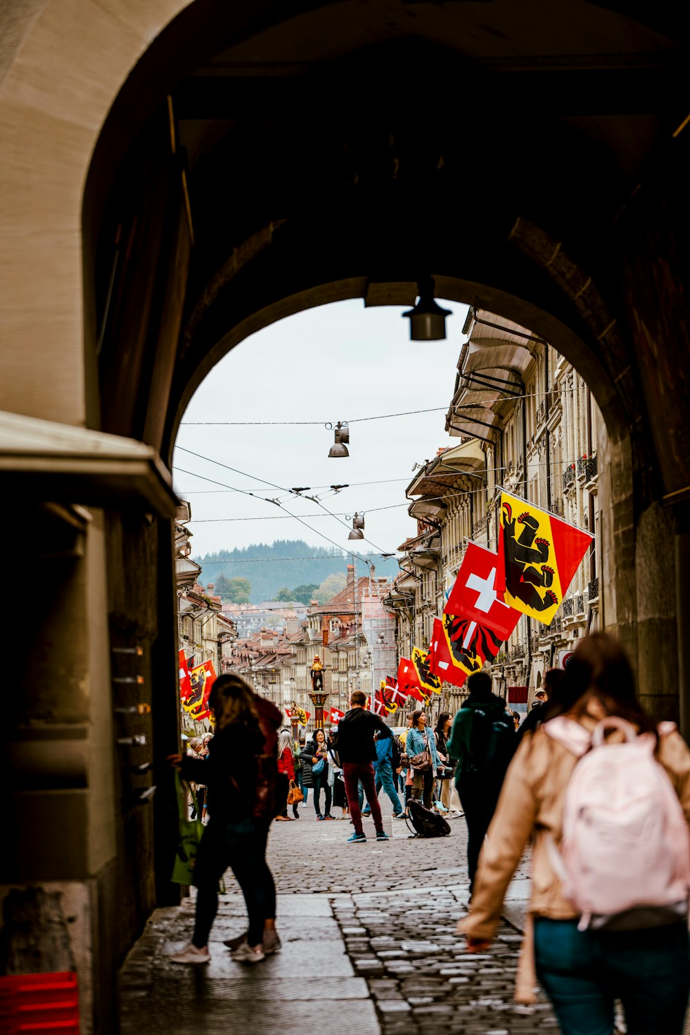 a group of people walking down a street