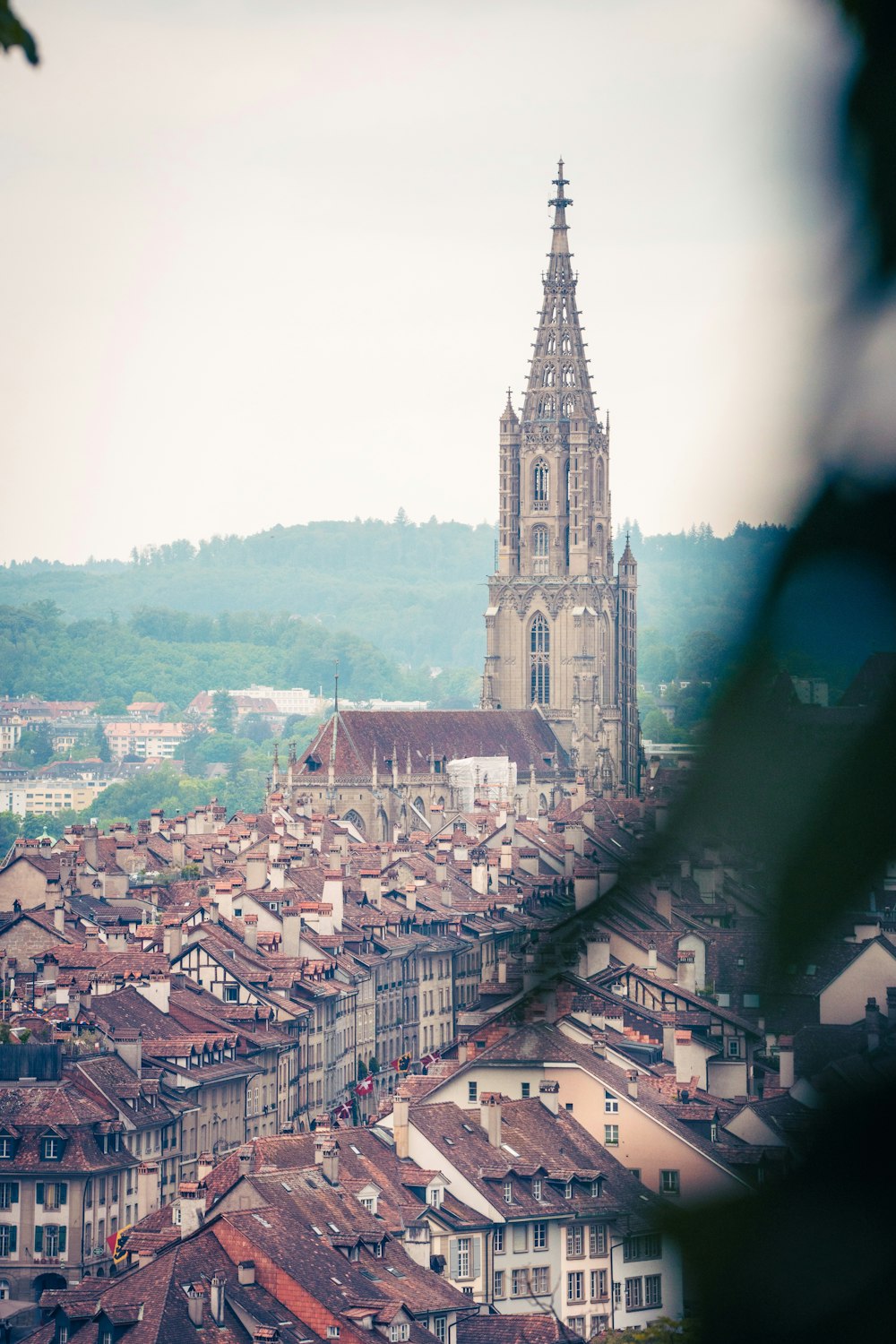 a view of a city with a very tall tower