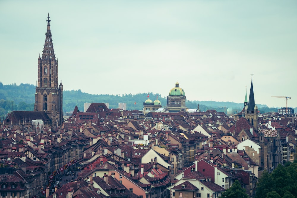 a view of a city with a church steeple in the background