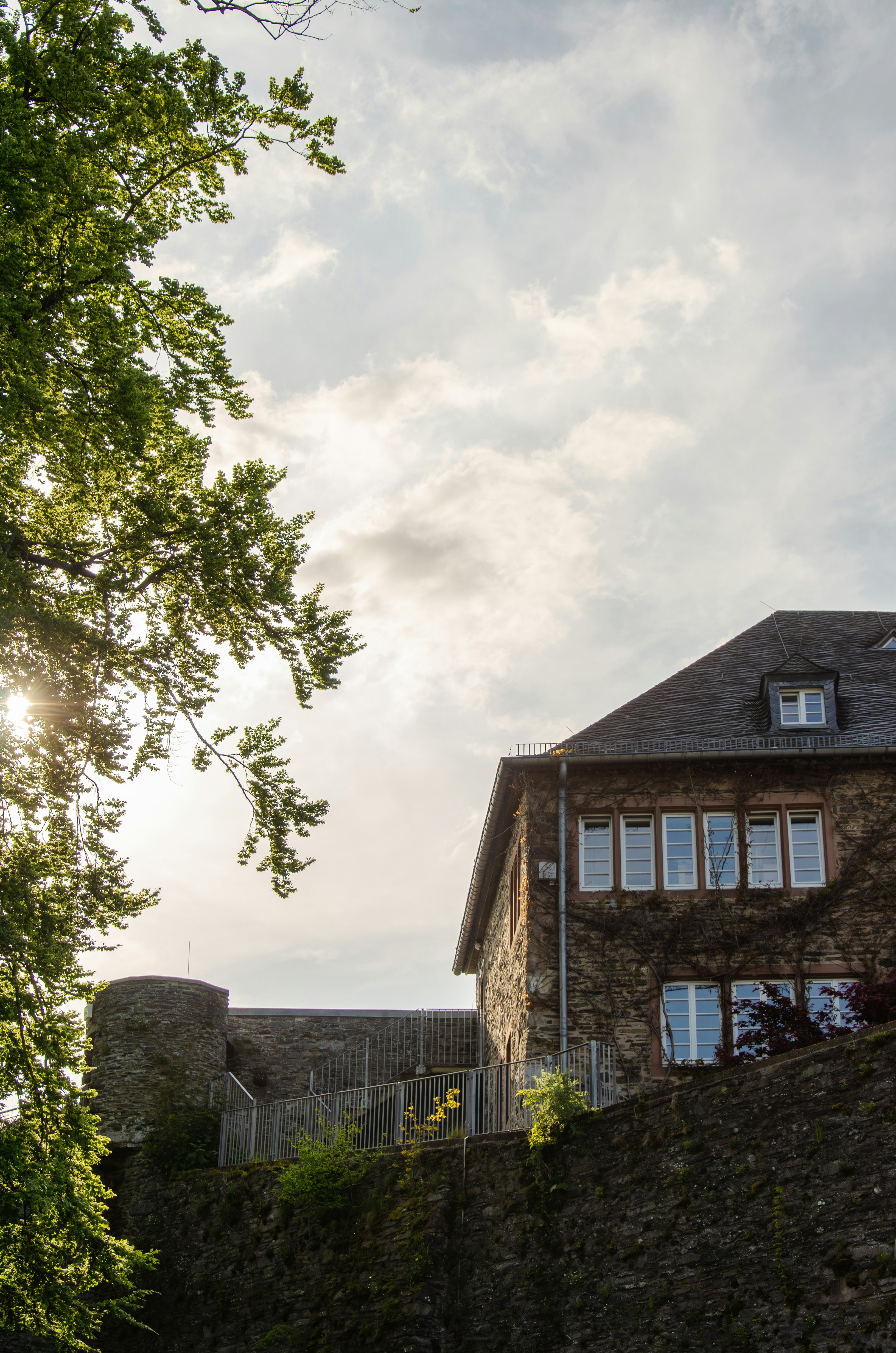 a large brick building sitting on top of a hill