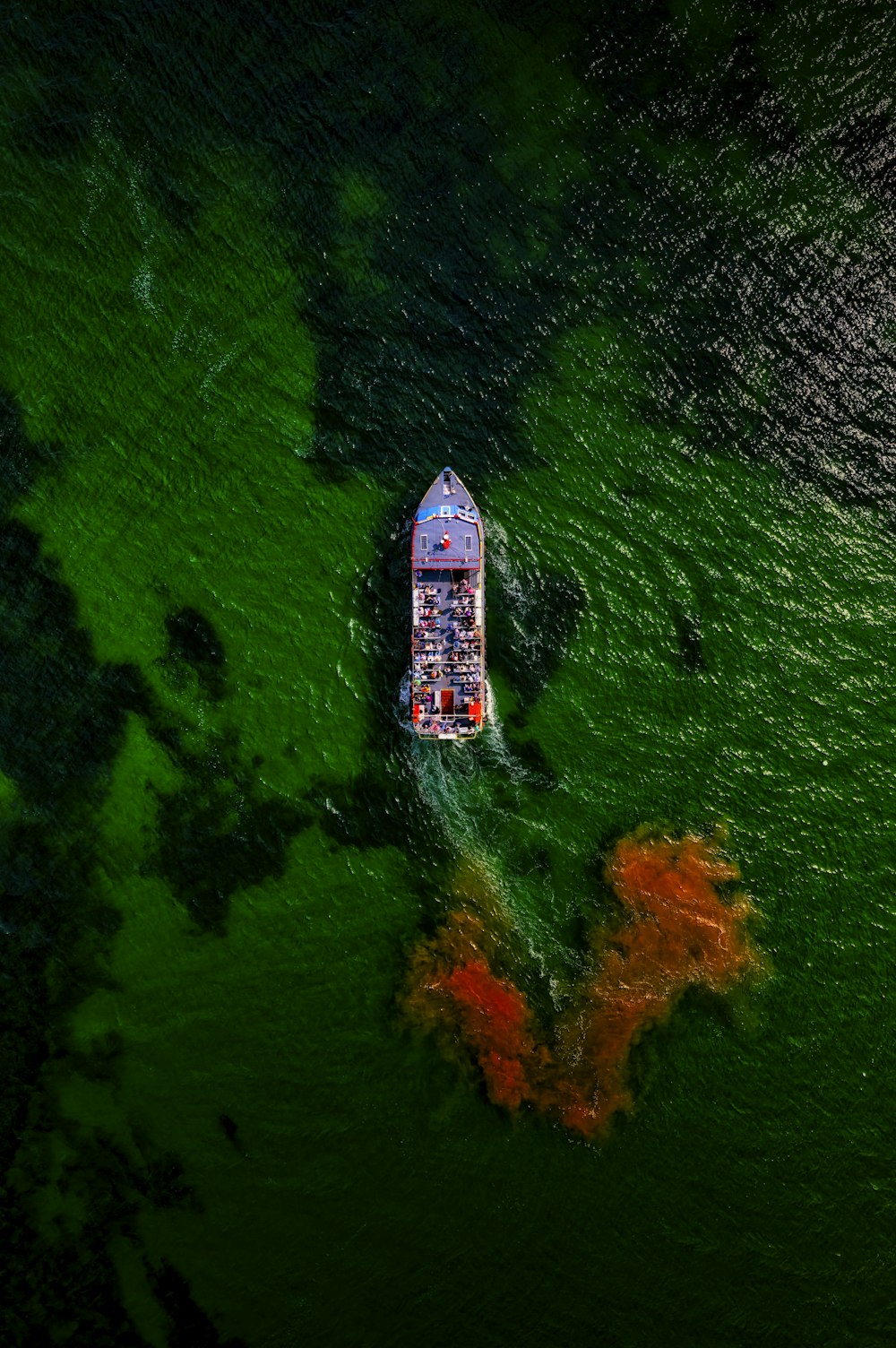 a boat floating on top of a body of water