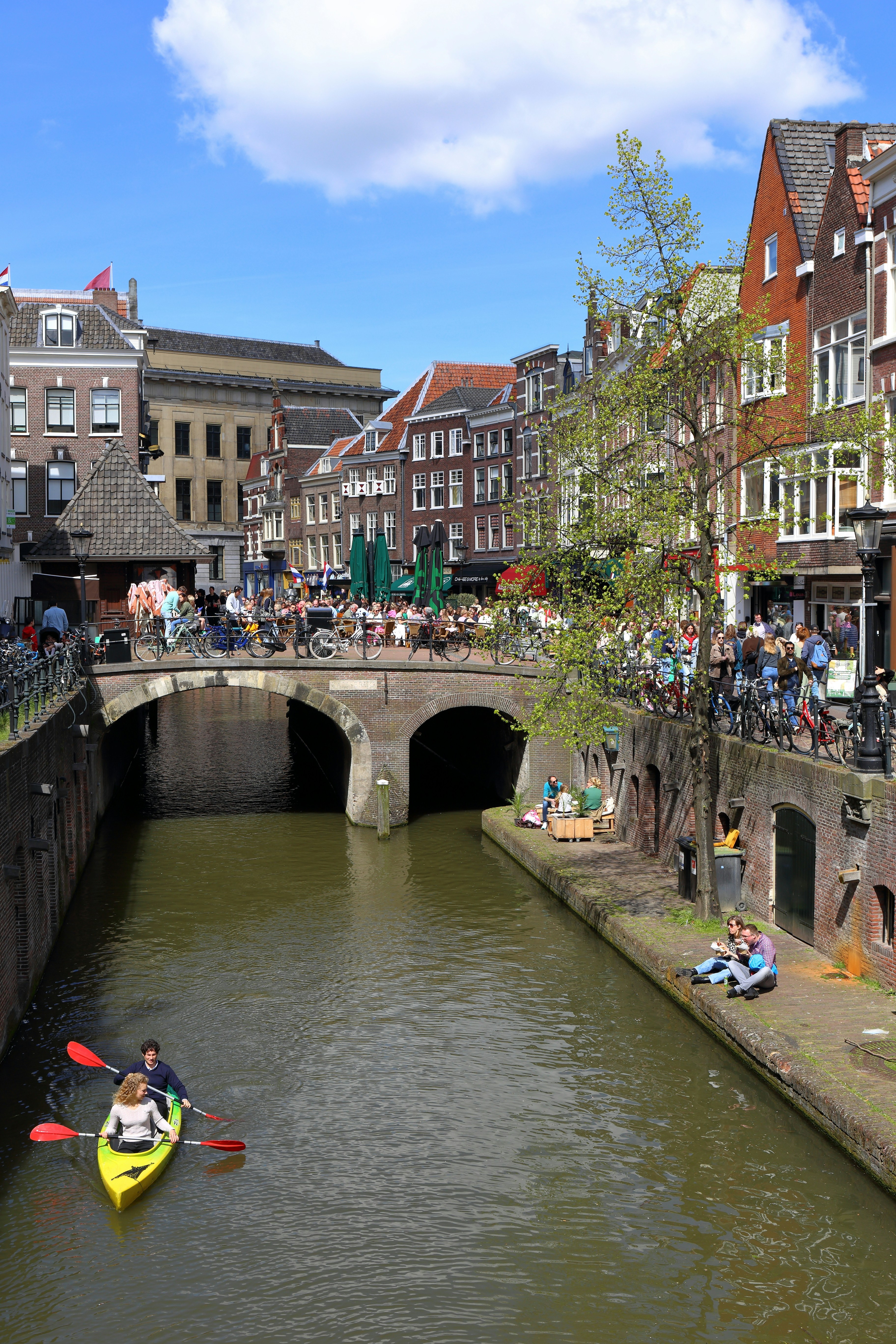 a group of people riding kayaks down a river