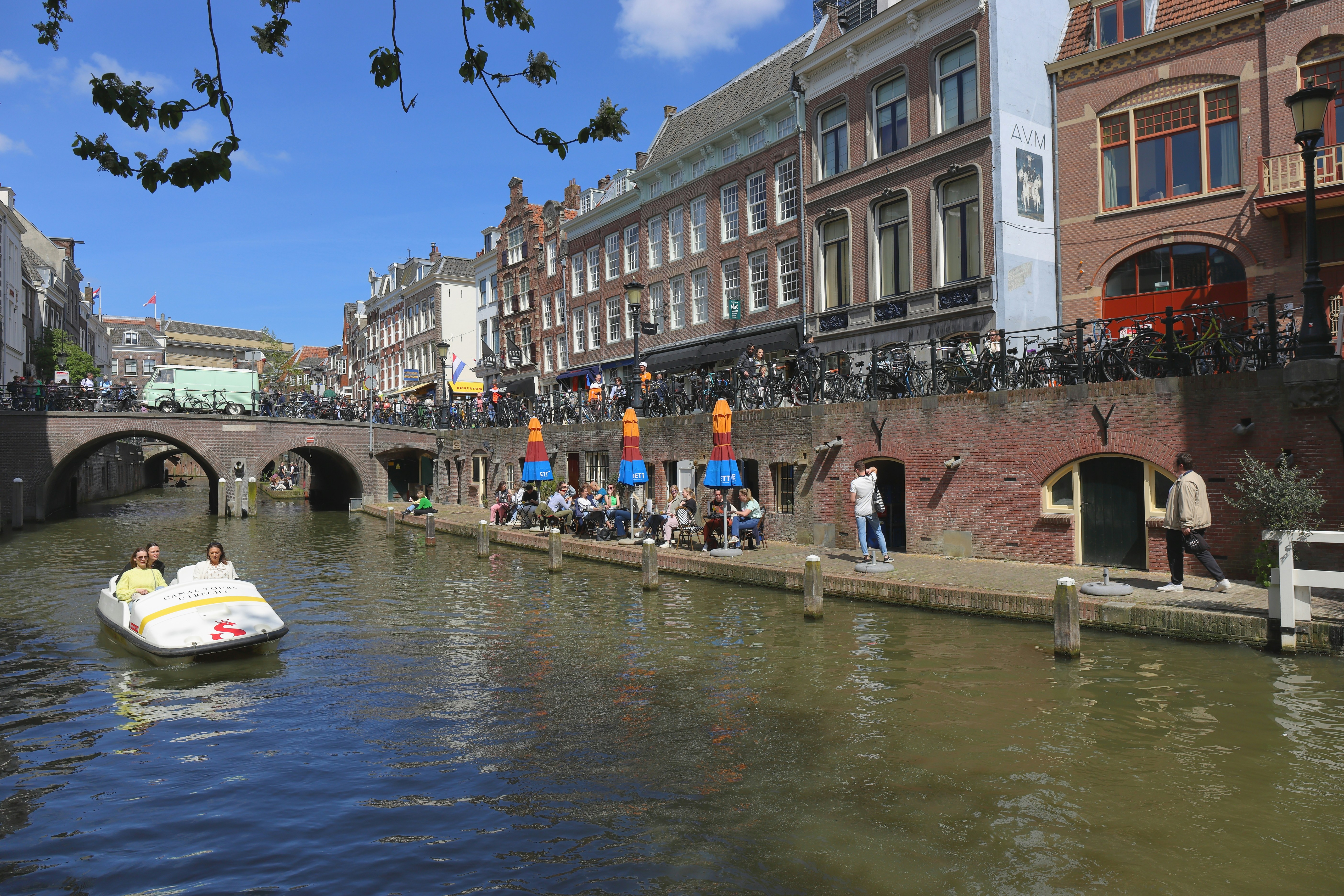 a group of people riding on a boat down a river